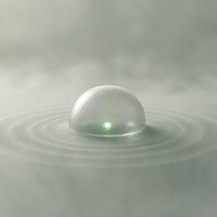 Glass dome with sonar rings around a small jade light